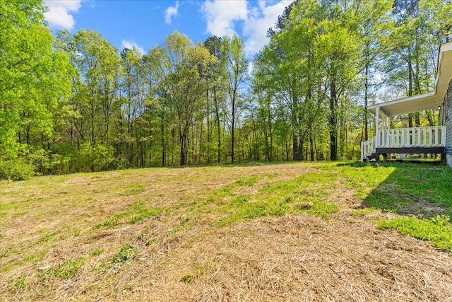 view of yard with a wooden deck