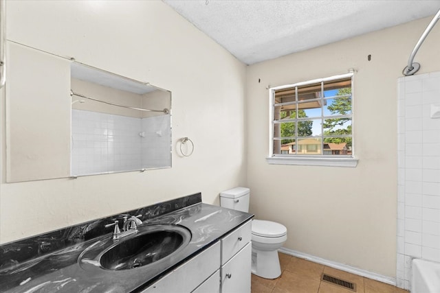 1307 Park Forrest Dr, Ft Oglethorpe, GA 30742 - full bath featuring vanity, toilet, a textured ceiling, tile patterned flooring, and  shower combination