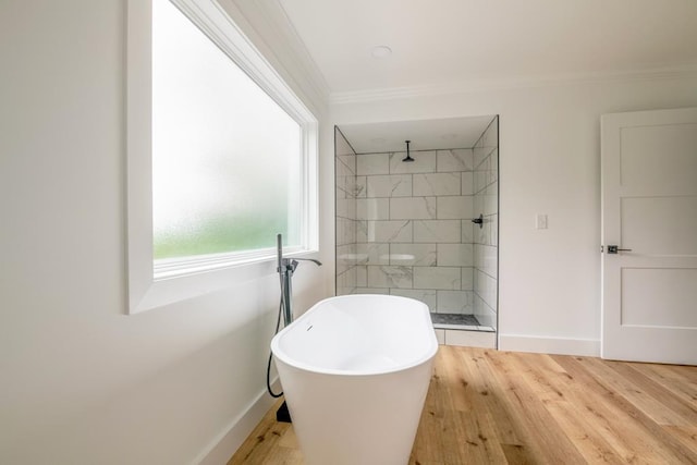 209 Crest Dr, Rocky Face, GA 30740 - bathroom with tiled shower, a freestanding tub, crown molding, baseboards, and wood finished floors