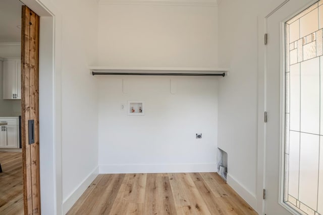 209 Crest Dr, Rocky Face, GA 30740 - laundry room featuring hookup for an electric dryer, hookup for a washing machine, light wood finished floors, baseboards, and crown molding