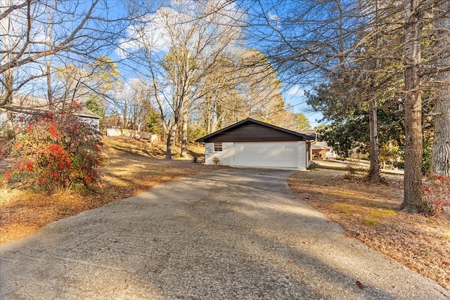 view of side of home with a garage