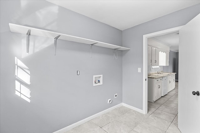 laundry area with washer hookup, sink, light tile patterned floors, and electric dryer hookup