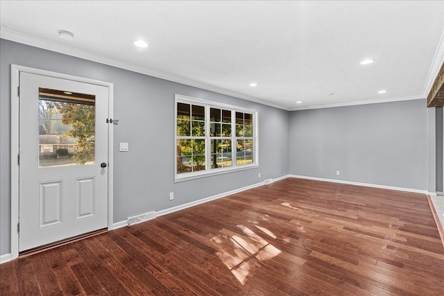 foyer entrance with hardwood / wood-style flooring, crown molding, and a textured ceiling