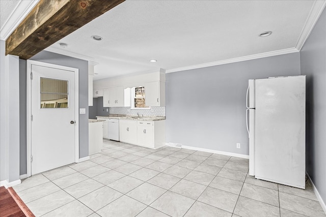 kitchen with crown molding, white appliances, white cabinets, light tile patterned flooring, and decorative backsplash