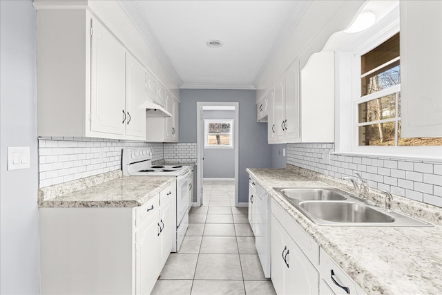 kitchen with light tile patterned flooring, white cabinetry, sink, ornamental molding, and white appliances