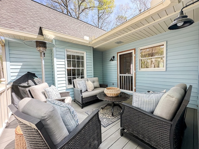 wooden deck with outdoor lounge area