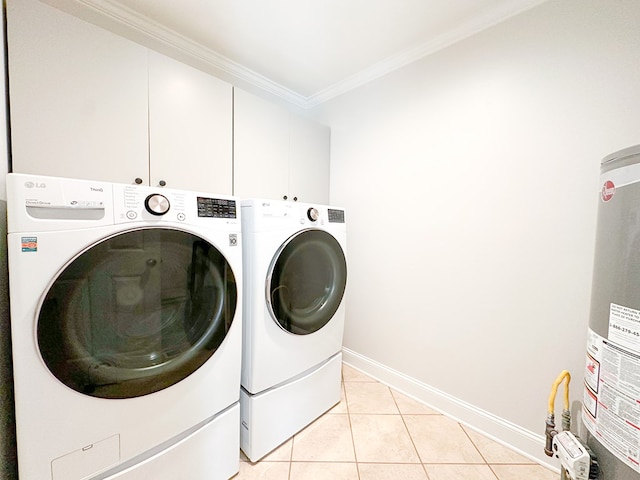 clothes washing area with independent washer and dryer, light tile patterned floors, gas water heater, and cabinet space