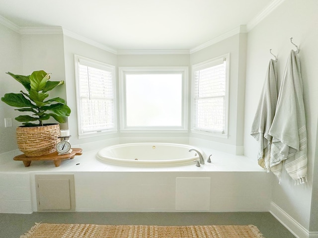 bathroom with crown molding, a whirlpool tub, and plenty of natural light