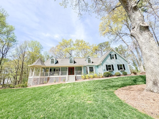 new england style home featuring a porch and a front lawn