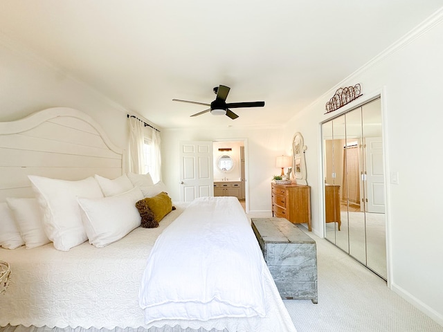 bedroom featuring ornamental molding, baseboards, a ceiling fan, and light carpet