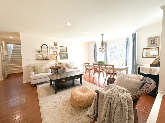 living area with crown molding, recessed lighting, stairway, and hardwood / wood-style flooring