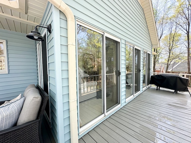 wooden deck with grilling area