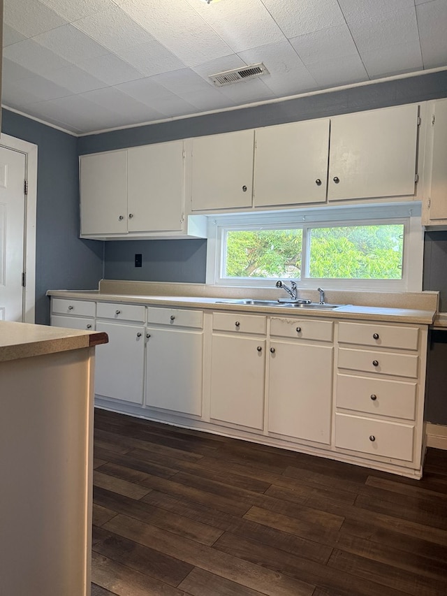 1802 Morris St, Dalton, GA 30721 - kitchen with dark wood-style flooring, a sink, light countertops, and white cabinets