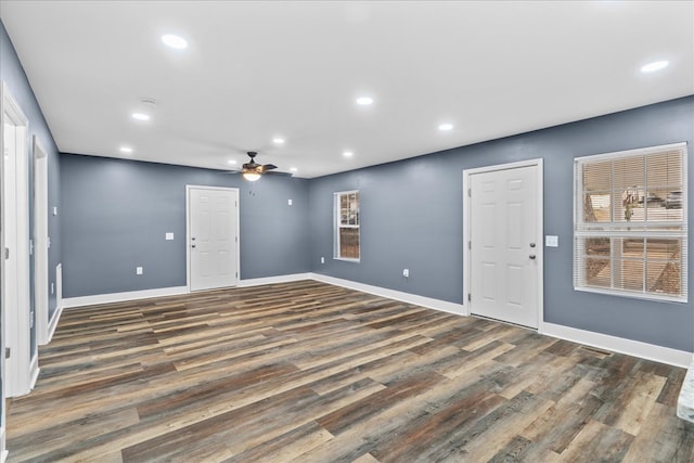 unfurnished room featuring dark hardwood / wood-style floors and ceiling fan