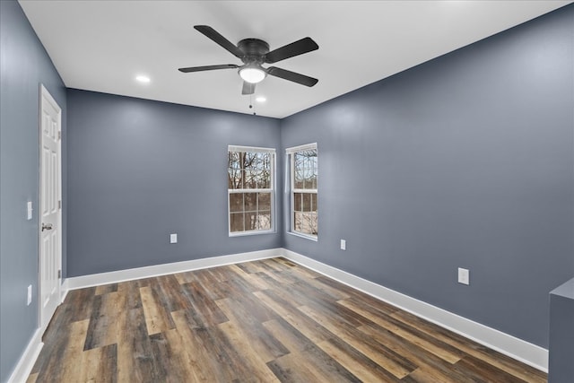 unfurnished room featuring ceiling fan and dark hardwood / wood-style floors