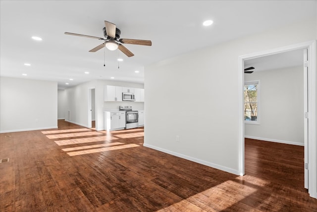 unfurnished living room with wood finished floors, recessed lighting, baseboards, and ceiling fan
