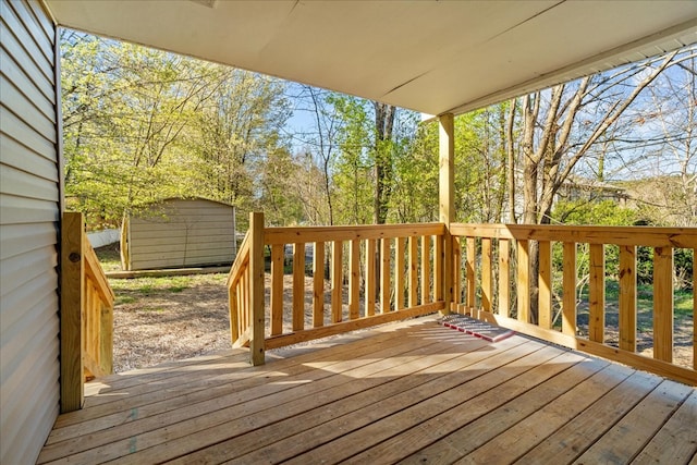 deck with an outbuilding and a storage shed