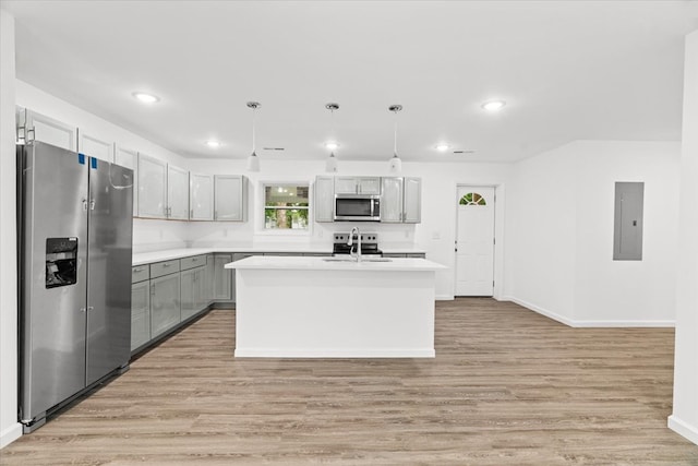 54 Austin Dr, Rossville, GA 30741 - kitchen featuring stainless steel appliances, electric panel, light wood-type flooring, light countertops, and pendant lighting