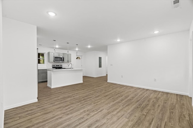 54 Austin Dr, Rossville, GA 30741 - unfurnished living room with recessed lighting, light wood finished floors, and electric panel