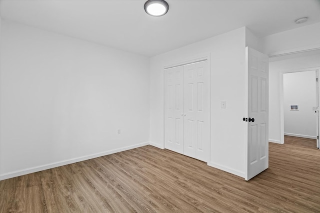 54 Austin Dr, Rossville, GA 30741 - unfurnished bedroom featuring wood finished floors and a closet