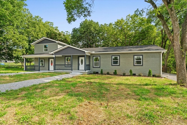 54 Austin Dr, Rossville, GA 30741 - view of front of house with a porch, a front yard, and brick siding