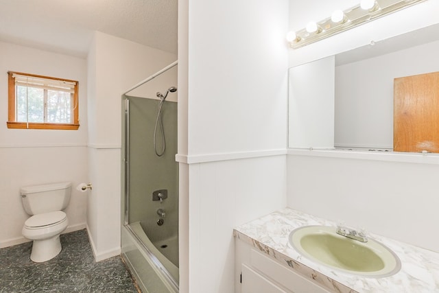 full bathroom with toilet, vanity, shower / bath combination with glass door, and a textured ceiling