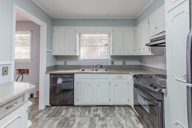 kitchen featuring sink, black appliances, light hardwood / wood-style flooring, ornamental molding, and white cabinets