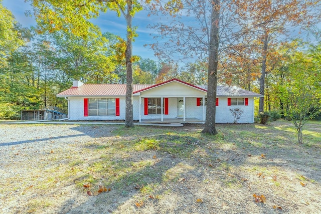 ranch-style house with covered porch