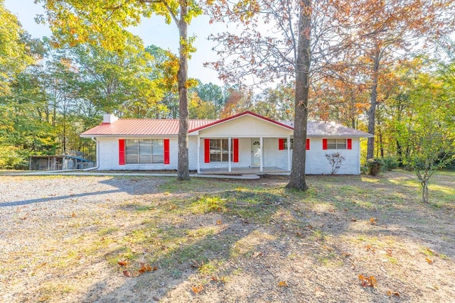 ranch-style home with covered porch