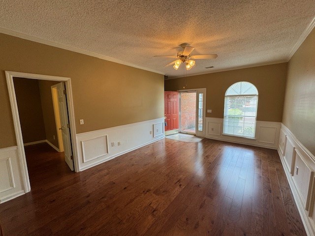 1694 Red Oak Dr Unit 185, Dalton, GA 30721 - spare room with a textured ceiling, ceiling fan, crown molding, dark wood-type flooring, and wainscoting