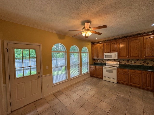 1694 Red Oak Dr Unit 185, Dalton, GA 30721 - kitchen with white appliances, light tile patterned floors, a textured ceiling, ceiling fan, and crown molding