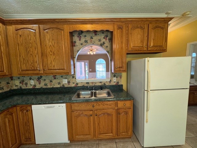 1694 Red Oak Dr Unit 185, Dalton, GA 30721 - kitchen featuring white appliances, brown cabinets, a sink, ornamental molding, and a textured ceiling