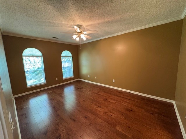 1694 Red Oak Dr Unit 185, Dalton, GA 30721 - spare room with ceiling fan, dark wood-style flooring, a textured ceiling, baseboards, and crown molding