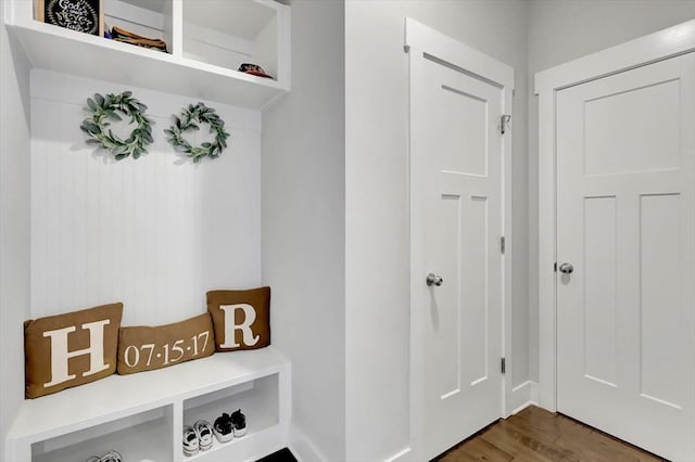 mudroom with dark wood-style flooring