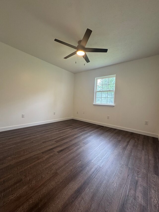 408 Ridgecrest Dr, Lafayette, GA 30728 - empty room featuring dark wood finished floors, ceiling fan, and baseboards