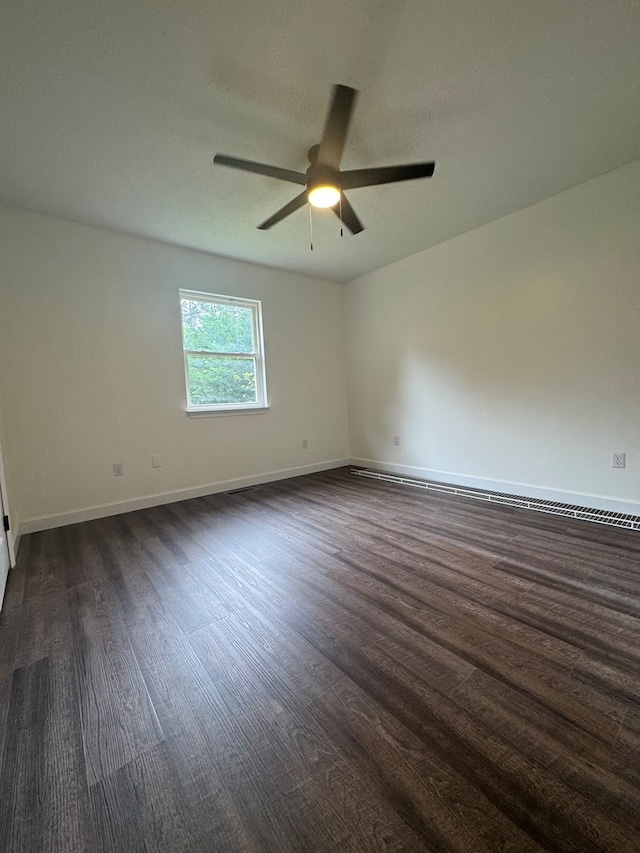 408 Ridgecrest Dr, Lafayette, GA 30728 - spare room with dark wood-style floors, a ceiling fan, and baseboards