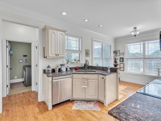 1000 Robin Way, Rocky Face, GA 30740 - kitchen with dishwasher, a sink, washer and dryer, light wood-style flooring, and ornamental molding