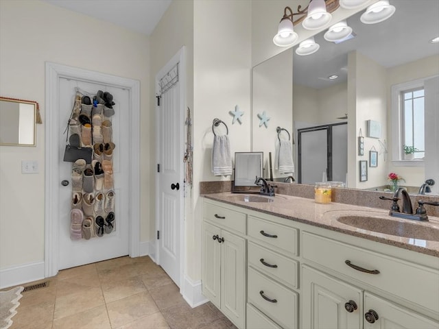 1000 Robin Way, Rocky Face, GA 30740 - bathroom with a shower stall, double vanity, tile patterned floors, and baseboards