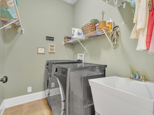 1000 Robin Way, Rocky Face, GA 30740 - washroom featuring separate washer and dryer, baseboards, and tile patterned floors