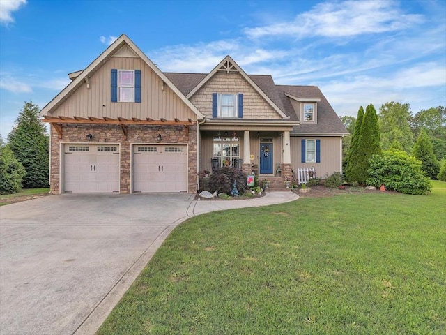 1000 Robin Way, Rocky Face, GA 30740 - craftsman-style home featuring concrete driveway, a front yard, a garage, and stone siding