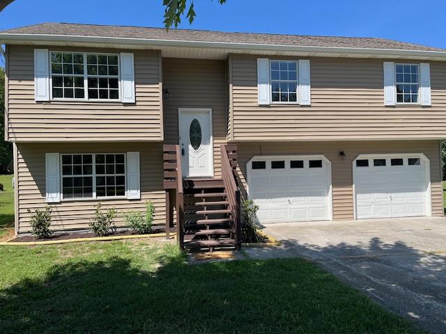 split foyer home featuring a garage