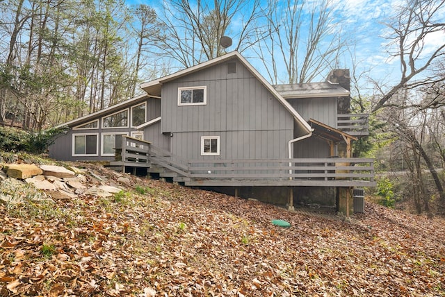 view of side of property with a wooden deck