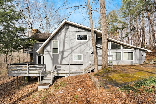 rear view of property with a wooden deck