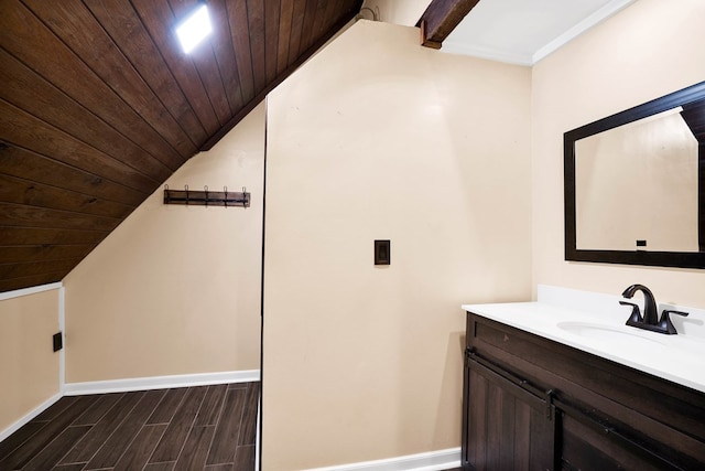 bathroom featuring hardwood / wood-style flooring, vanity, lofted ceiling, and wooden ceiling