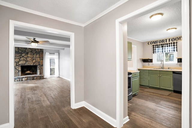 corridor featuring sink, crown molding, dark wood-type flooring, a textured ceiling, and beam ceiling