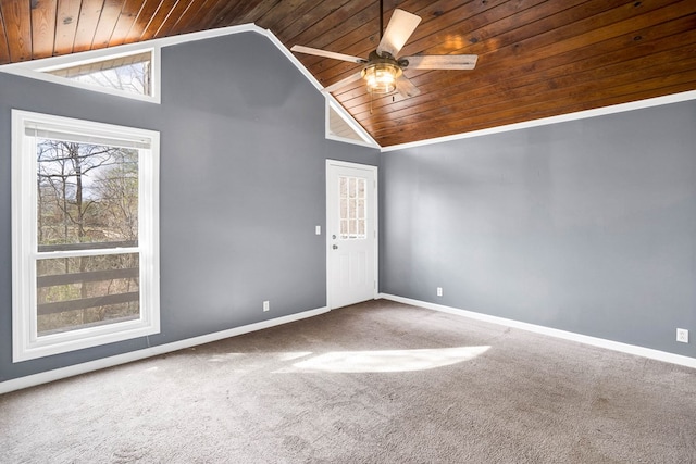 carpeted spare room with vaulted ceiling, ceiling fan, and wood ceiling