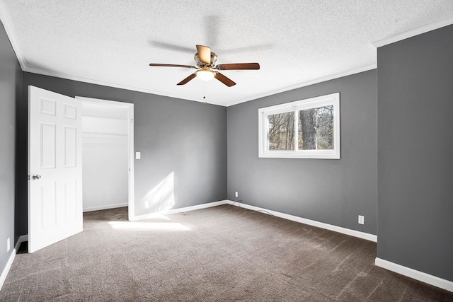 interior space with crown molding, a textured ceiling, and ceiling fan