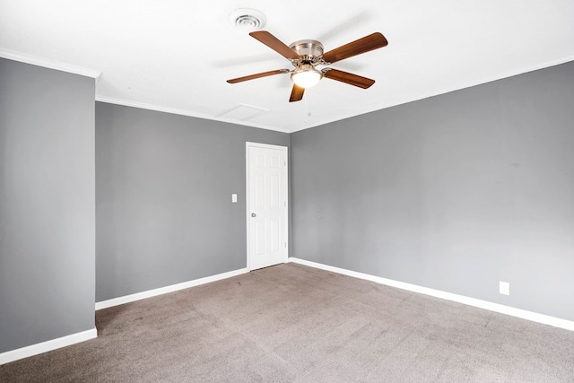 carpeted spare room with ornamental molding and ceiling fan