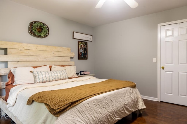 bedroom featuring dark hardwood / wood-style flooring and ceiling fan