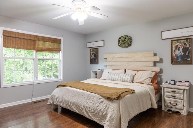 bedroom with dark wood-type flooring and ceiling fan